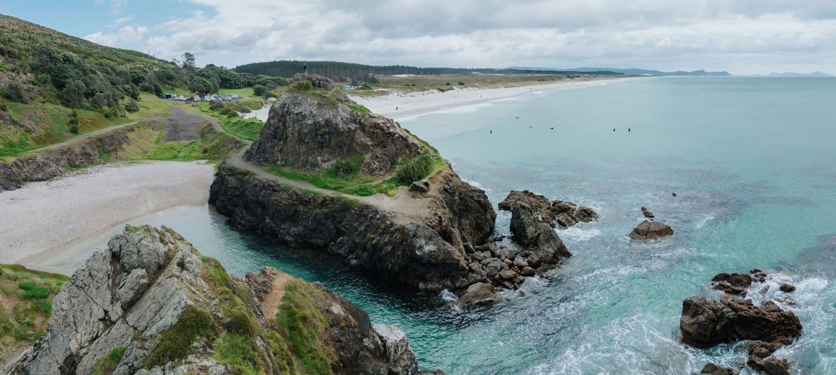 The headland known as The Quarry, sheltered swimming spot, awesome water jumps, Te Ārai surf spot, Auckland / Rodney, New Zea