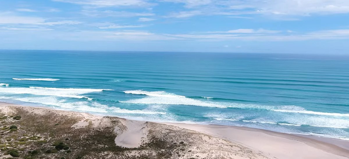 Clean Tasman lines breaking along the Hokianga coast, Waimamaku surf spot, Northland West, New Zealand.
